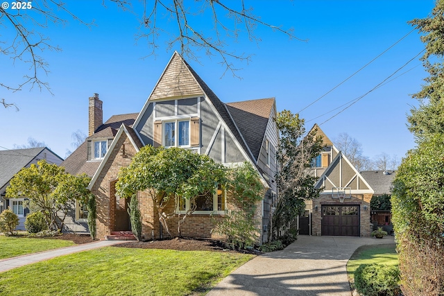 english style home featuring a front lawn