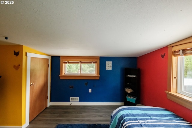 40325 Upper Calapooia Dr, Sweet Home, OR 97386 - bedroom with dark wood finished floors and a textured ceiling