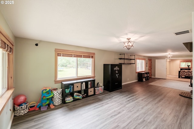 40325 Upper Calapooia Dr, Sweet Home, OR 97386 - recreation room with healthy amount of natural light and wood finished floors