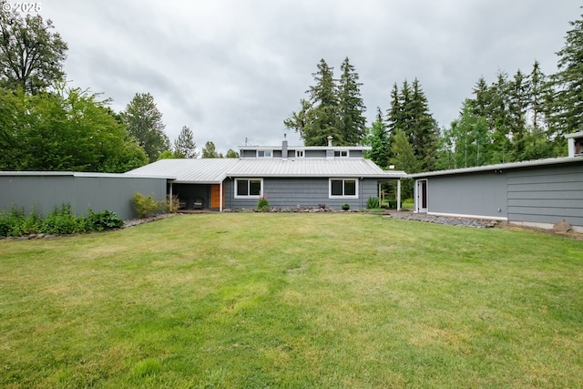 40325 Upper Calapooia Dr, Sweet Home, OR 97386 - rear view of house featuring a lawn and a metal roof