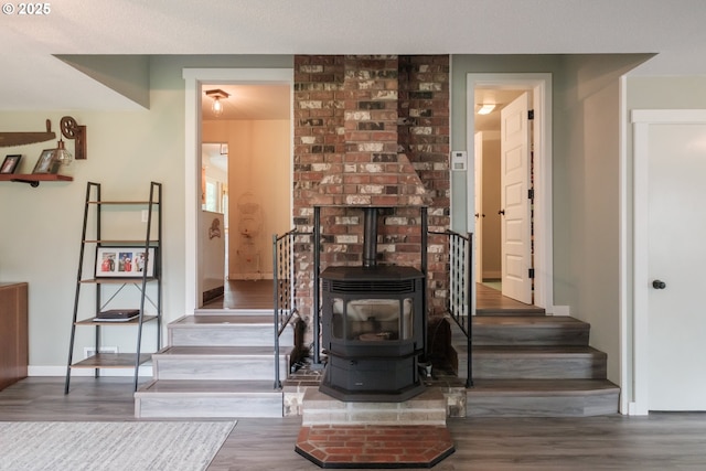 40325 Upper Calapooia Dr, Sweet Home, OR 97386 - living area featuring stairway, wood finished floors, and a wood stove