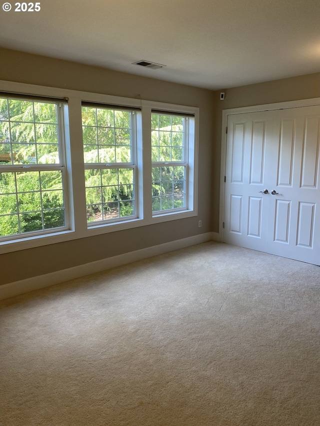 9587 NW Caxton Ln, Portland, OR 97229 - unfurnished bedroom featuring carpet and a closet