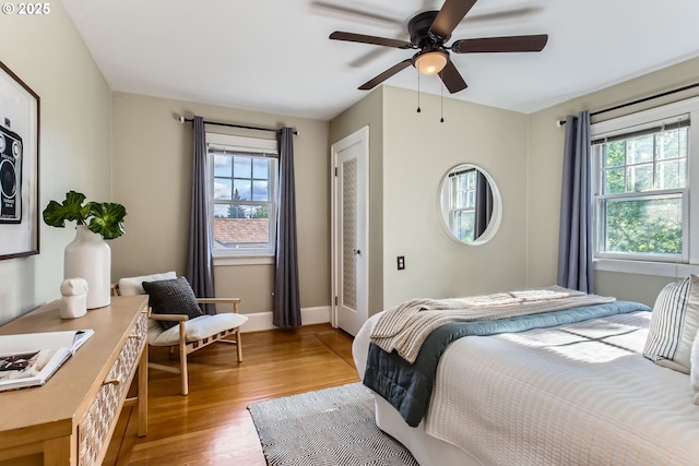5536 N Delaware Ave, Portland, OR 97217 - bedroom featuring light wood-style floors, ceiling fan, and baseboards