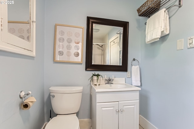 5536 N Delaware Ave, Portland, OR 97217 - bathroom with vanity, toilet, and baseboards
