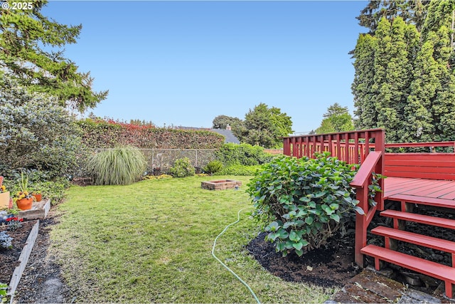 5536 N Delaware Ave, Portland, OR 97217 - view of yard featuring a fire pit and a wooden deck