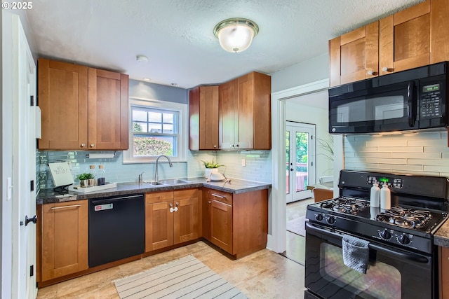 5536 N Delaware Ave, Portland, OR 97217 - kitchen featuring black appliances, a sink, brown cabinetry, backsplash, and dark stone countertops