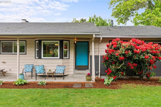 7005 SW 14th Ave, Portland, OR 97219 - doorway to property featuring a yard, covered porch, and roof with shingles