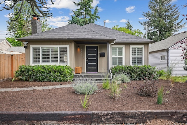 7913 SE Henderson St, Portland, OR 97206 - view of front of home featuring a chimney, roof with shingles, and board and batten siding