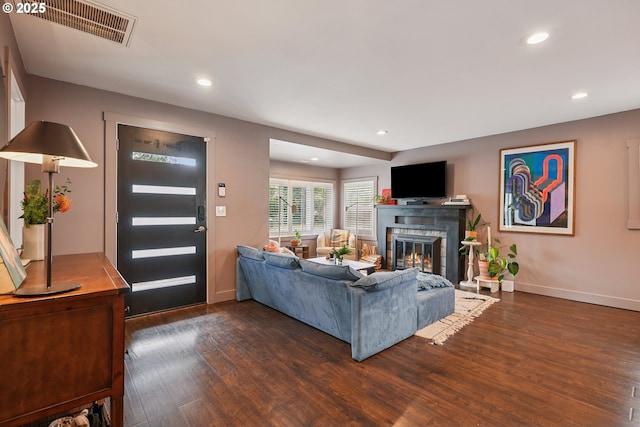 7913 SE Henderson St, Portland, OR 97206 - living area with dark wood-style flooring, a glass covered fireplace, and recessed lighting