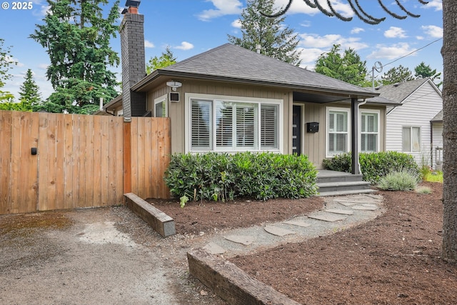 7913 SE Henderson St, Portland, OR 97206 - view of front facade with a chimney, board and batten siding, and a shingled roof