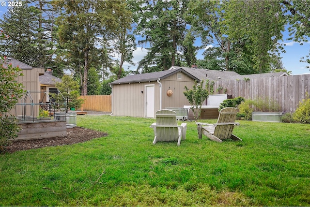7913 SE Henderson St, Portland, OR 97206 - fenced backyard with a vegetable garden and an outdoor structure