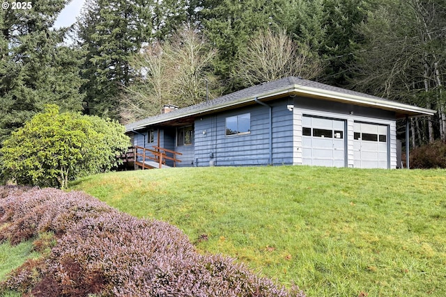 garage featuring a yard