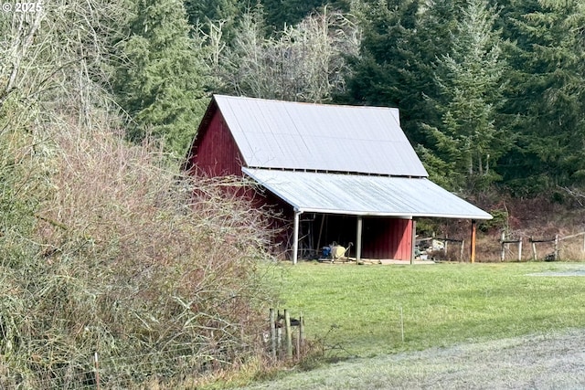 view of outbuilding with a yard