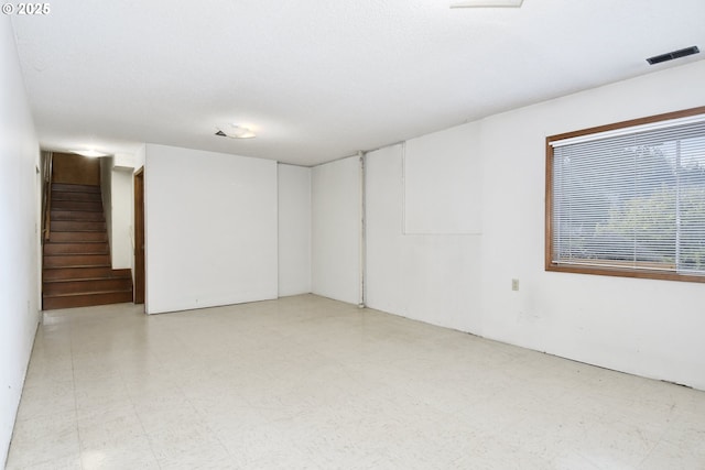 spare room featuring a textured ceiling