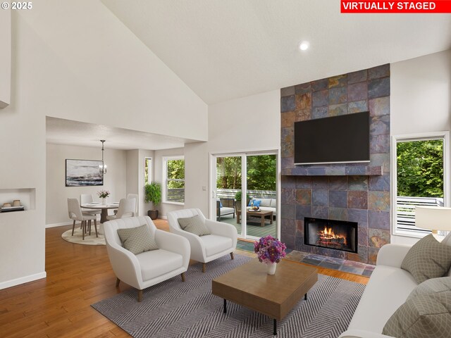 15917 NE Union Rd Unit 103, Ridgefield, WA 98642 - living area with high vaulted ceiling, wood finished floors, a fireplace, and recessed lighting