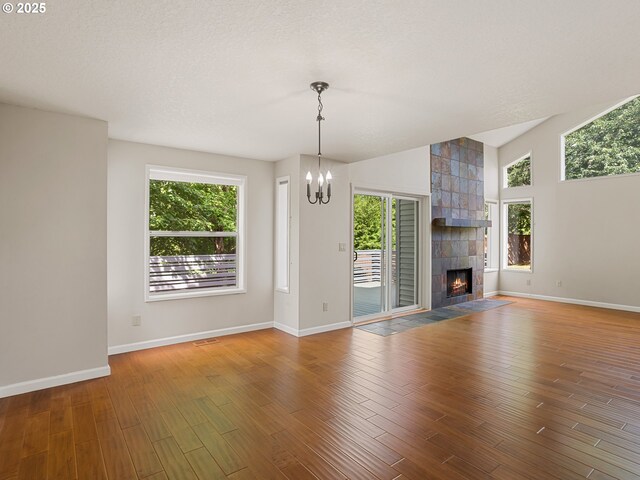 15917 NE Union Rd Unit 103, Ridgefield, WA 98642 - unfurnished living room with a chandelier, plenty of natural light, and wood finished floors