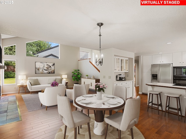 15917 NE Union Rd Unit 103, Ridgefield, WA 98642 - dining area with wood finished floors and a chandelier