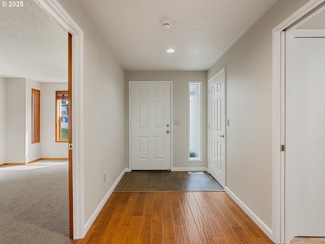 15917 NE Union Rd Unit 103, Ridgefield, WA 98642 - foyer entrance featuring wood finished floors, recessed lighting, and a textured ceiling
