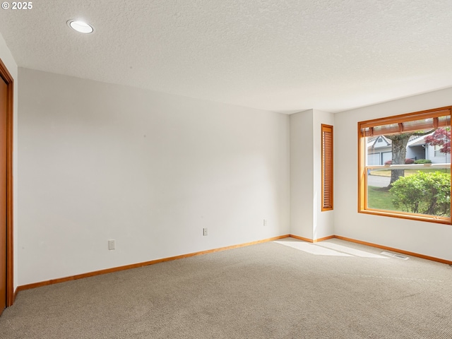 15917 NE Union Rd Unit 103, Ridgefield, WA 98642 - empty room featuring carpet, a textured ceiling, and recessed lighting