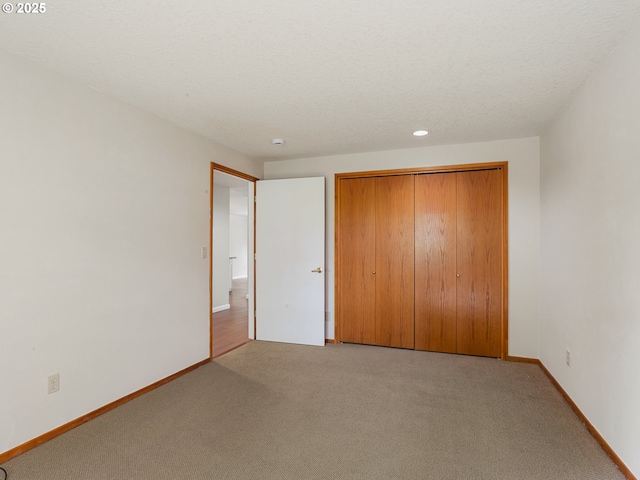 15917 NE Union Rd Unit 103, Ridgefield, WA 98642 - unfurnished bedroom with light carpet, a closet, and recessed lighting