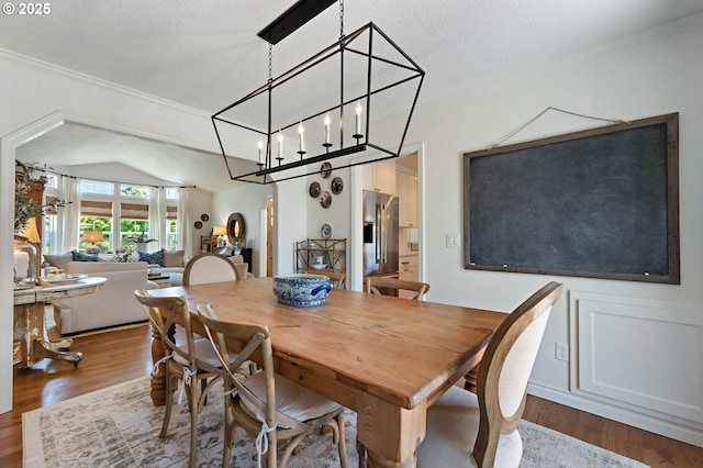 20525 Martin Ct, West Linn, OR 97068 - dining space featuring wood finished floors, arched walkways, lofted ceiling, and crown molding