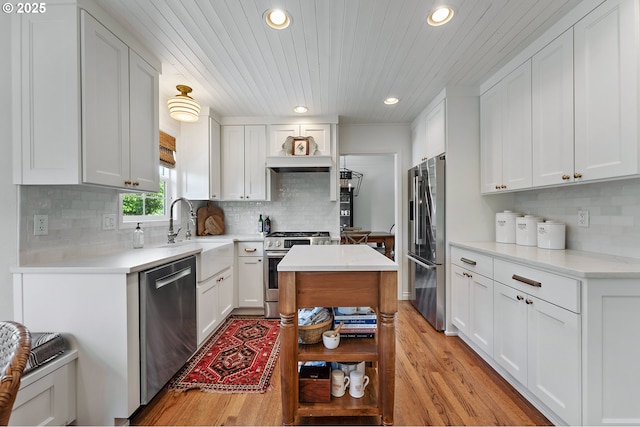 20525 Martin Ct, West Linn, OR 97068 - kitchen with appliances with stainless steel finishes, light wood-style flooring, recessed lighting, tasteful backsplash, and wooden ceiling