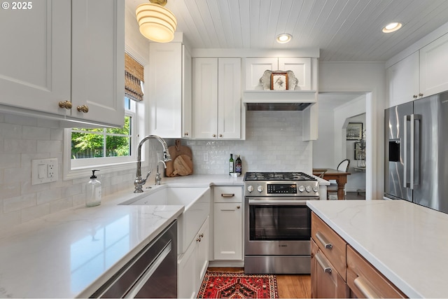 20525 Martin Ct, West Linn, OR 97068 - kitchen with stainless steel appliances, white cabinetry, recessed lighting, light stone countertops, and wooden ceiling