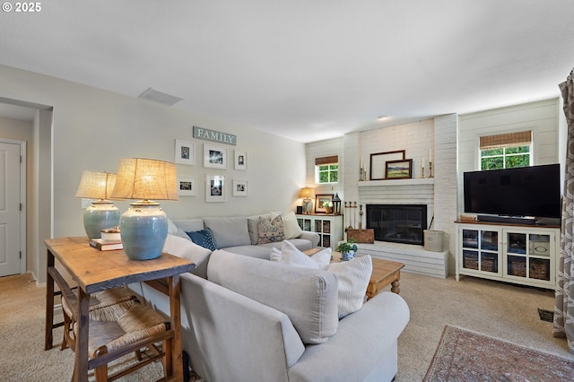 20525 Martin Ct, West Linn, OR 97068 - living room featuring carpet flooring, healthy amount of natural light, and a brick fireplace