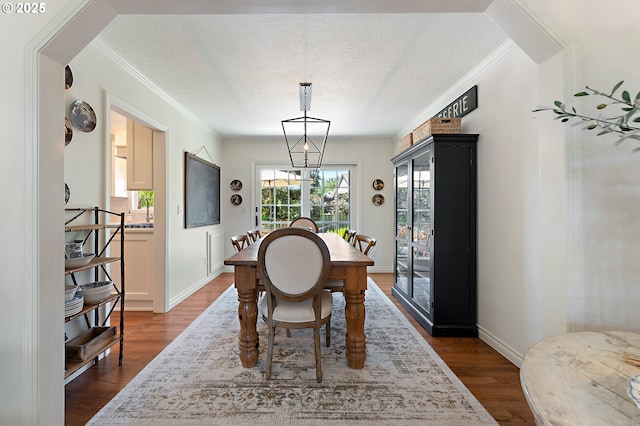 20525 Martin Ct, West Linn, OR 97068 - dining space featuring dark wood-style floors, a textured ceiling, and ornamental molding