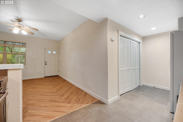 630 NE Adwick Dr, Hillsboro, OR 97006 - entrance foyer featuring baseboards, ceiling fan, recessed lighting, and a textured ceiling