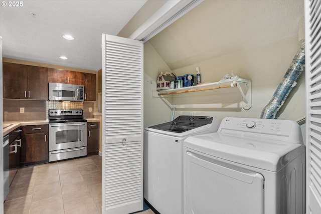 630 NE Adwick Dr, Hillsboro, OR 97006 - laundry area with washer and clothes dryer, recessed lighting, and light tile patterned floors