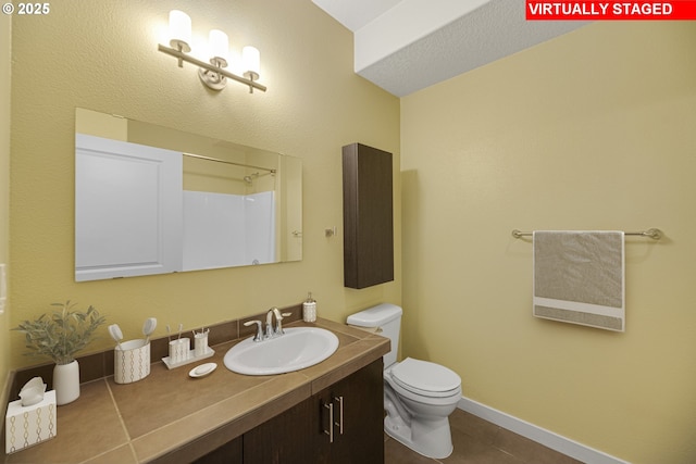 630 NE Adwick Dr, Hillsboro, OR 97006 - full bath with vanity, toilet, tile patterned floors, baseboards, and a shower