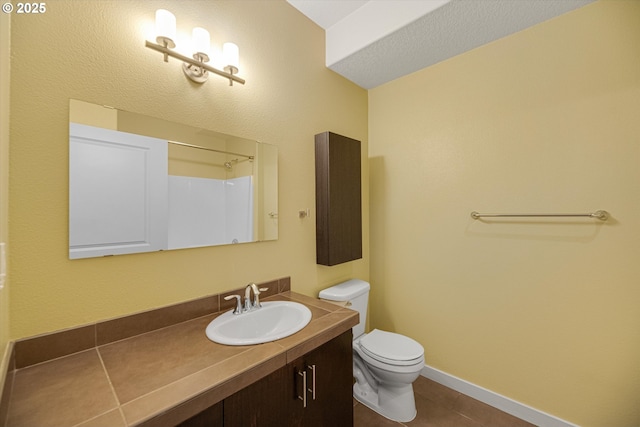630 NE Adwick Dr, Hillsboro, OR 97006 - full bathroom featuring vanity, toilet, tile patterned flooring, and baseboards
