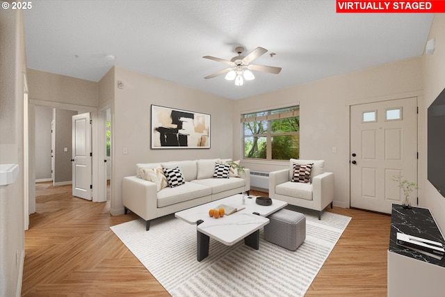 630 NE Adwick Dr, Hillsboro, OR 97006 - living room featuring a ceiling fan and baseboards