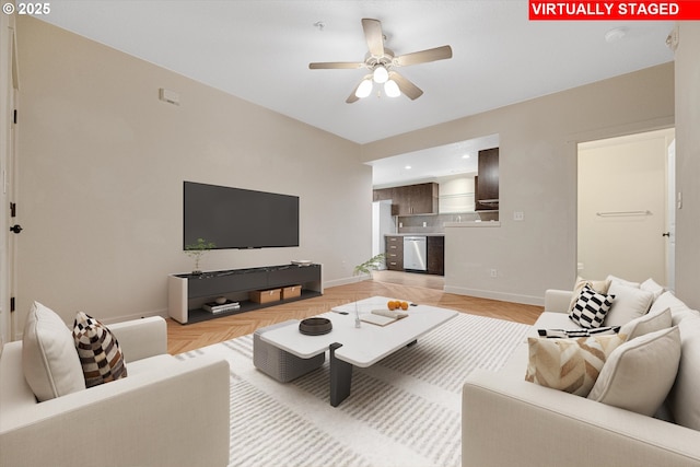 630 NE Adwick Dr, Hillsboro, OR 97006 - living room featuring a ceiling fan and baseboards