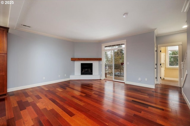 unfurnished living room with crown molding, a healthy amount of sunlight, and dark hardwood / wood-style flooring