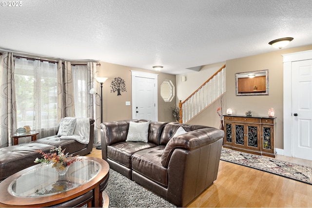 16506 NE 13th St, Vancouver, WA 98684 - living area with a textured ceiling, wood finished floors, and stairway