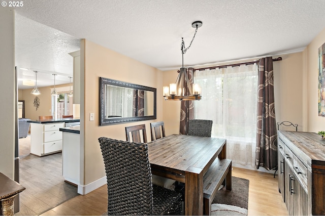 16506 NE 13th St, Vancouver, WA 98684 - dining room with a chandelier, a textured ceiling, and light wood-style floors