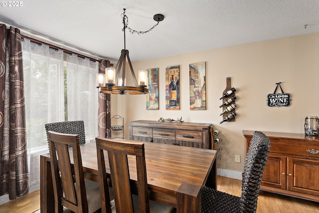 16506 NE 13th St, Vancouver, WA 98684 - dining area featuring light wood-style flooring and a chandelier