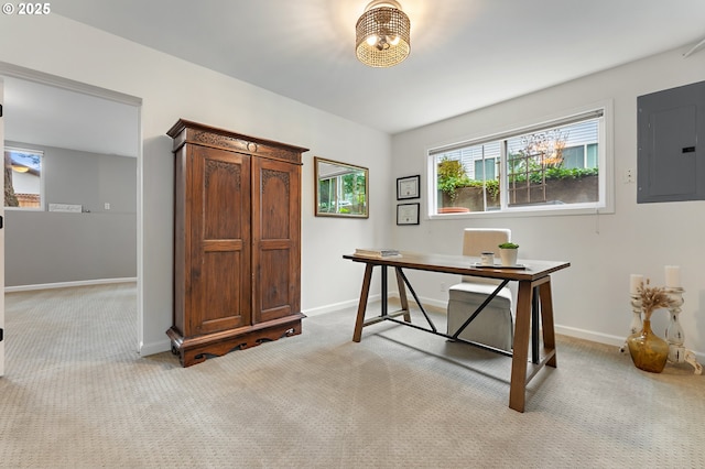 carpeted office featuring electric panel and baseboards