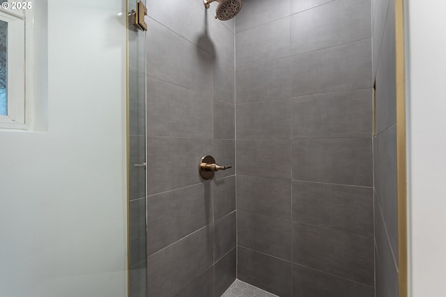 full bath featuring a tile shower