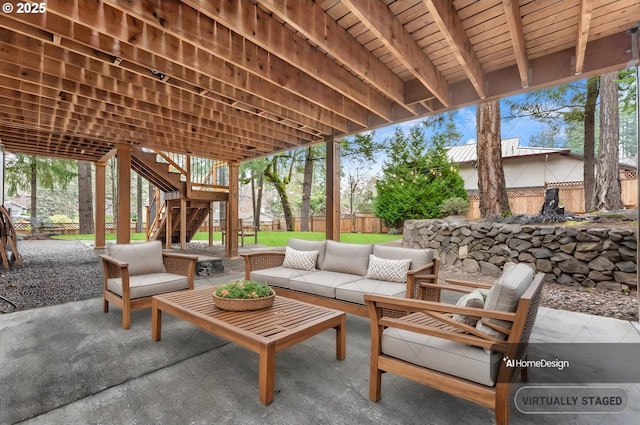 view of patio with stairway, an outdoor hangout area, and fence