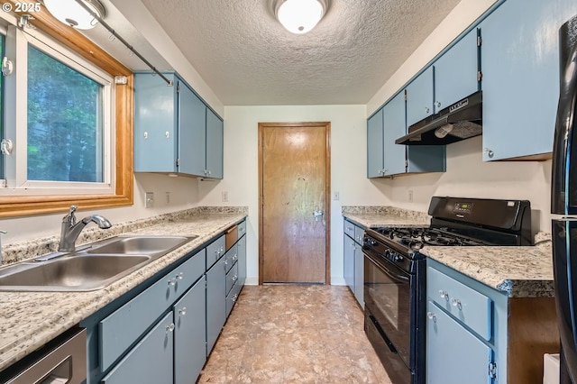 121 SE 34th Cir, Troutdale, OR 97060 - kitchen featuring black appliances, under cabinet range hood, blue cabinets, light countertops, and a textured ceiling