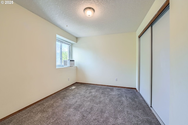 121 SE 34th Cir, Troutdale, OR 97060 - unfurnished bedroom featuring a textured ceiling, carpet, and a closet