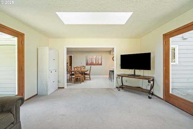 16390 SE Hillside Ln, Milwaukie, OR 97267 - carpeted living room featuring a skylight