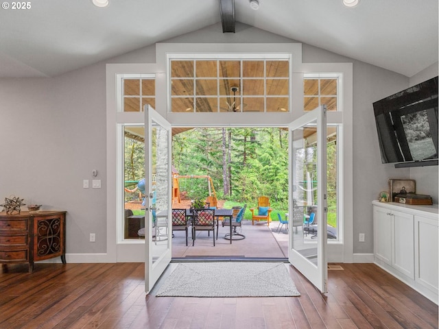 doorway featuring french doors, lofted ceiling with beams, baseboards, and wood finished floors