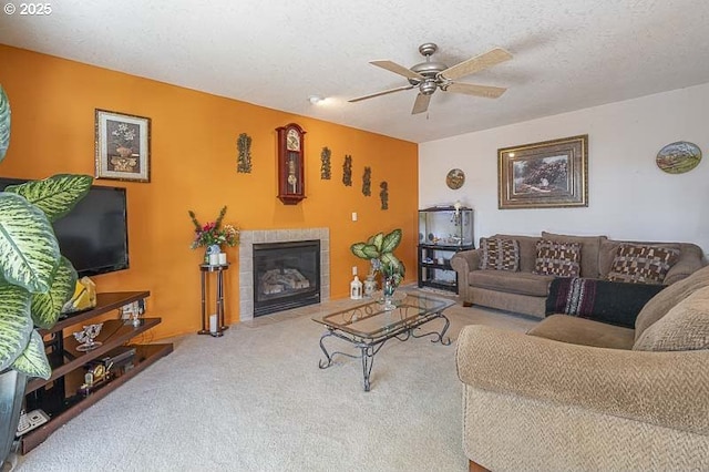 1227 Trent Ave, Keizer, OR 97303 - living area featuring carpet floors, a ceiling fan, and a tiled fireplace