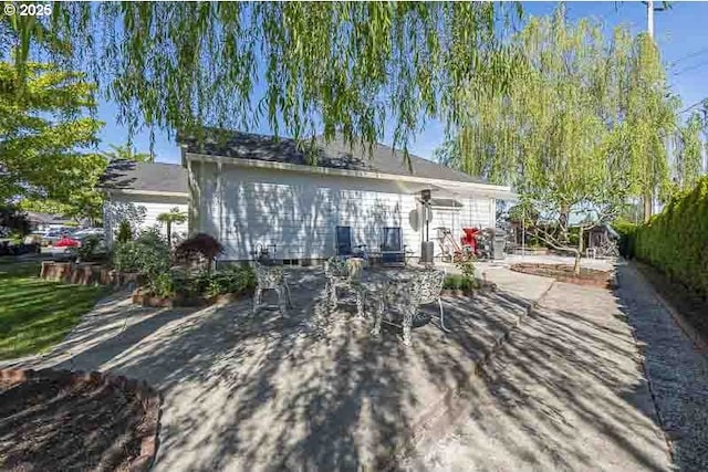 1227 Trent Ave, Keizer, OR 97303 - back of house with a patio area