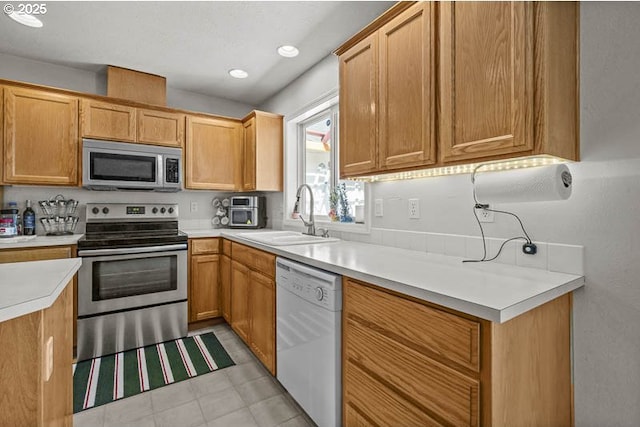 1227 Trent Ave, Keizer, OR 97303 - kitchen featuring appliances with stainless steel finishes, a sink, light countertops, and recessed lighting