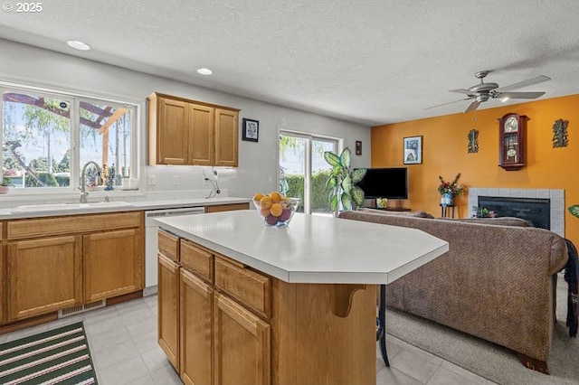1227 Trent Ave, Keizer, OR 97303 - kitchen with a sink, light countertops, open floor plan, dishwasher, and a kitchen island